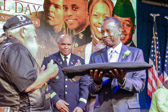 Hogs & Heroes Foundation member Master Sergeant Jesse McMillian (USAF/USA Retired) presented a POW/MIA flag to Secretary Ben Carson