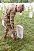 Within four hours, more than a thousand Old Guard Soldiers will place a small American flag one foot in front of and centered at more than 220,000 grave markers, to honor every individual buried at Arlington National Cemetery.  Old Guard Soldiers will also place an American flag at the foot of each Columbarium.