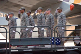 Dignified transfer officer orders “Present, Arms” (slow movement salute)