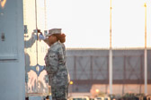 Transfer vehicle guide Airman Mercedes McCoy-Garrnett  slowly closes the doors to transfer vehicle