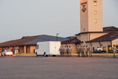 Mortuary vehicle driver starts engine, and Security Forces vehicle moves into escort position in front<br />Transfer vehicle begins to pull away Dignified transfer officer orders final “Present, Arms” and “Order, Arms” (slow salute) as vehicle departs<br />Carry team follows (by walking) transfer vehicle, with the transfer vehicle guide walking behind the carry team Dignified transfer officer and senior ranking officer follow (walking) behind the transfer vehicle guide, ending the dignified transfer