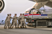 L/Cpl Gregory A. Posey being removed from the K loader to the transfer vehicle.
