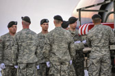 Staff Sergeant Johnny Roosevelt Polk being taken from the K loader to the transfer vehicle.