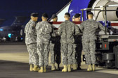 Carry team carries transfer case of Captain Benjamin A. Sklaver  to the mortuary transfer vehicle