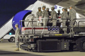 Transfer case of Spc. Russell Hercules Jr. is moved into position on K-loader