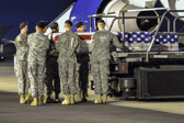 Carry team carries transfer case of Spc. Paul E. Andersen to the mortuary transfer vehicle