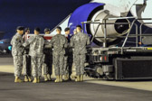 Carry team carries transfer case of Spc. Russell Hercules Jr. to the mortuary transfer vehicle