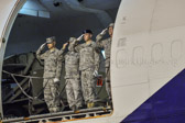 Dignified transfer officer orders “Present, Arms” (slow movement salute)