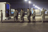 Dignified transfer officer orders “Present, Arms” (slow movement salute)