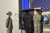 Carry team places transfer case of Pfc. Brandon A. Owens to the mortuary transfer vehicle