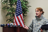 Major Shannon L. Mann preps the media