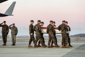 Dignified transfer officer orders “Present, Arms” (slow movement salute)
