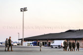Carry team follows (by walking) transfer vehicle, with the transfer vehicle guide walking behind the carry team<br />Dignified transfer officer and senior ranking officer follow (walking) behind the transfer vehicle guide, ending the dignified transfer