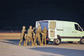 Carry team moves transfer case into the mortuary transfer vehicle Dignified transfer officer orders “Order, Arms” (slow movement salute)