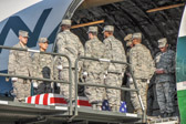 Chaplin Lt. Col. Carl Groh, US Air Force saying a prayer for the fallen Marines.