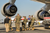 Dignified transfer officer orders “Present, Arms” (slow movement salute)