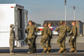 Dignified transfer officer orders “Order, Arms” (slow movement salute)