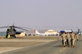 The Soldiers carry team fly to Dover in Blackhawk helicopters, wearing the ACU is much more practical than wearing the ceremonial blues uniform the Soldiers wear when rendering final honors in Arlington National Cemetery. The Soldiers wear the gloves so they can better grip the casket.