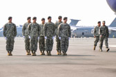 Dignified transfer officer and senior ranking officer depart aircraft.