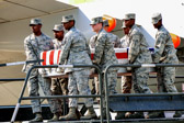 Dover AFB carry team moves up the transfer case of Sgt. Louis R. Fastuca.