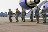 The dignified transfer officer orders “Present, Arms” (slow movement salute).