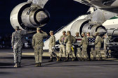 Dignified transfer officer orders “Present, Arms” (slow movement salute)
