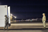 Transfer Vehicle Guide Senior Airman Christy Edward-Batts slowly closes the doors of the transport vehicle.
