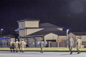 Carry team follows (by walking) transfer vehicle, with the transfer vehicle guide walking behind the carry team<br />Dignified transfer officer and senior ranking officer follow (walking) behind the transfer vehicle guide, ending the dignified transfer
