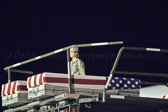The transfer cases containing the remains of Capt. Michael W. Newton and L/Cpl. Jason D. Hill