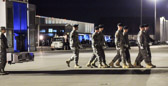 From the aircraft to the transfer vehicle the carry teams prepare to honor those who have given their lives in the service of our country. The vehicle then moves the fallen to the port mortuary.