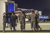Army carry team moves the transfer case with the believed to be remains of Capt. Michael W. Newton into mortuary transfer vehicle.