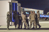 Marine carry team moves the transfer case with the believed to be remains of L/Cpl. Joshua B. McDaniels into mortuary transfer vehicle.