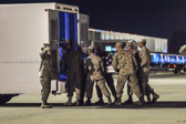 Marine carry team moves the transfer case with the believed to be remains of L/Cpl. Sean M. O'Conner into mortuary transfer vehicle.