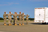 The Final Steps, the mortuary vehicle driver starts engine, and Security Forces vehicle moves into escort position in front. The Transfer vehicle begins to pull away. Dignified transfer officer orders final “Present, Arms” and “Order, Arms” (slow salute) as vehicle departs. Carry team follows (by walking) transfer vehicle, with the transfer vehicle guide walking behind the carry team.