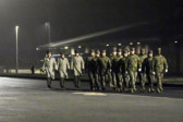The sequence of the dignified transfer starts with the fallen being returned to Dover by the most expedient means possible, which may mean a direct flight from theater, or a flight to Ramstein Air Base, Germany, and then to Dover. It is the Department of Defense's policy, and AFMAO's , mission, to return America's fallen to their loved ones as quickly as possible. Once the aircraft lands at Dover, service-specific carry teams remove the transfer cases individually from the aircraft and move them to a waiting mortuary transport vehicle. Once all of the transfer cases have been taken to the transport vehicles, they are then taken to the port mortuary.