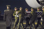 Dignified transfer officer orders “Present, Arms” (slow movement salute)