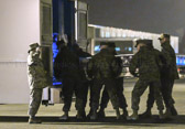 Marine carry team carries transfer case of Cpl. Kevin J. Reinhard  to the mortuary transfer vehicle
