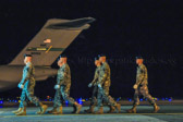 The sequence of the dignified transfer starts with the fallen being returned to Dover by the most expedient means possible, which may mean a direct flight from theater, or a flight to Ramstein Air Base, Germany, and then to Dover. It is the Department of Defense's policy, and AFMAO's , mission, to return America's fallen to their loved ones as quickly as possible. Once the aircraft lands at Dover, service-specific carry teams remove the transfer cases individually from the aircraft and move them to a waiting mortuary transport vehicle. Once all of the transfer cases have been taken to the transport vehicles, they are then taken to the port mortuary.