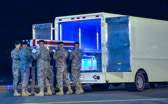 Carry team carries transfer case of Staff Sgt. Ricardo Seija to the mortuary transfer vehicle