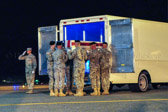 Carry team carries transfer case of Spc. Cameron J. Stambaugh to the mortuary transfer vehicle
