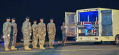 Transfer vehicle guide Senior Airman Joshua Fernandez closes the doors to transfer vehicle
