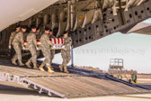 Carry team carries transfer case of Sgt. David J. Chambers to the mortuary transfer vehicle