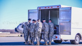 Carry team places the transfer case of Sgt. David J. Chambers into the mortuary transfer vehicle