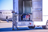 Transfer vehicle guide Senior Airman Amn Tameca Burnett closes the doors to transfer vehicle