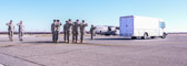 Final Steps Mortuary vehicle driver starts engine, and Security Forces vehicle moves into escort position in front Transfer vehicle begins to pull away<br />Dignified transfer officer orders final “Present, Arms” and “Order, Arms” (slow salute) as vehicle departs Carry team follows (by walking) transfer vehicle, with the transfer vehicle guide walking behind the carry team