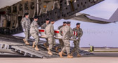 Army carry team moves the transfer case containing the believed to be remains of Civilian Contractor, Hyun K Shin to the mortuary transfer vehicle