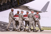 Air Force carry team carries transfer case of Capt. Reid K. Nishizuka to the mortuary transfer vehicle