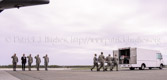 Air Force carry team carries transfer case of Staff Sgt. Daniel N. Fannin to the mortuary transfer vehicle