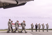 Dignified transfer officer orders “Present, Arms” (slow movement salute)