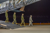 After Chaplain Matthew Boarts has said some prayers for Sgt. Daniel M. Vasselian the host party departs the aircraft.